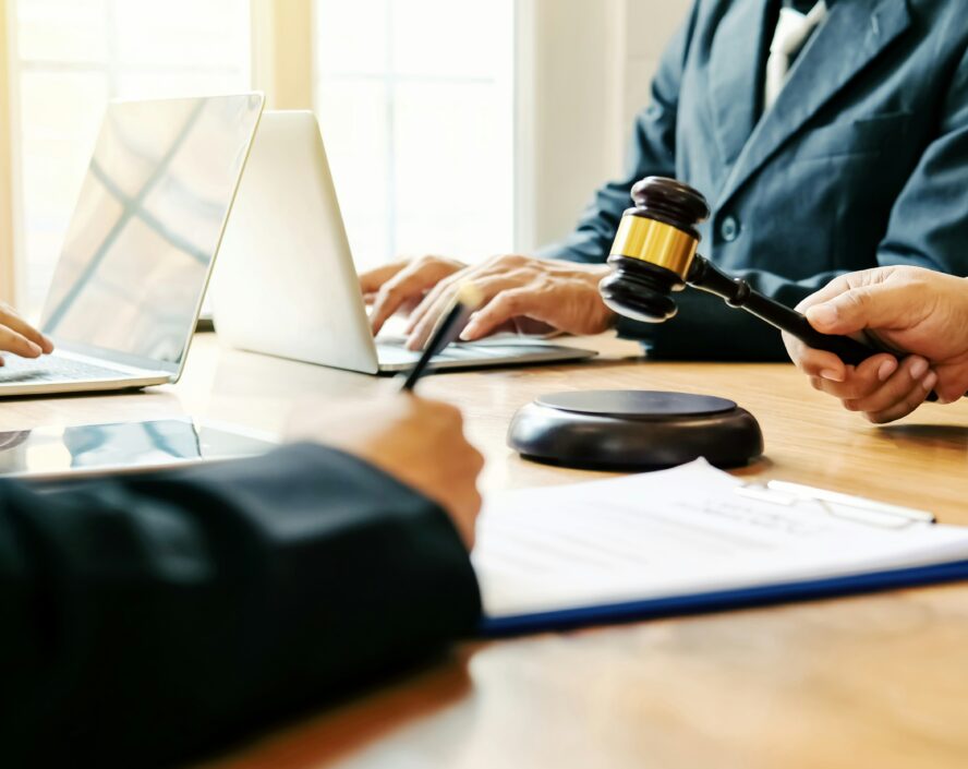 people's hands working at the court table