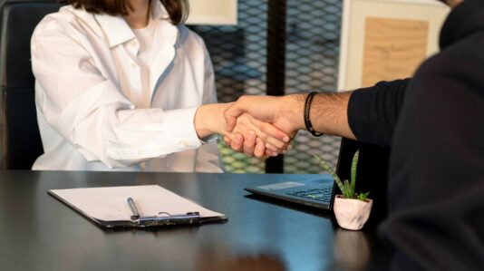 two people shaking hands