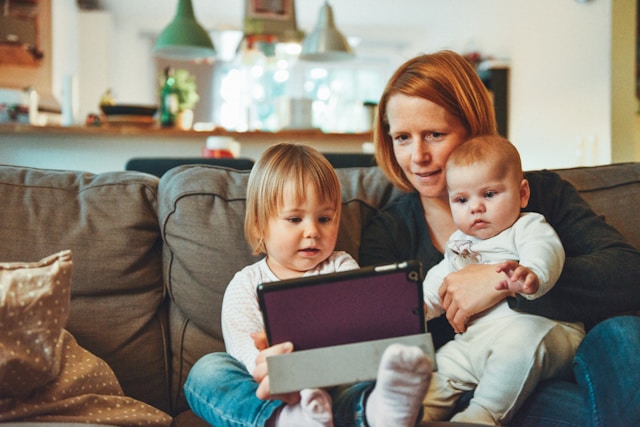 a woman with 2 children