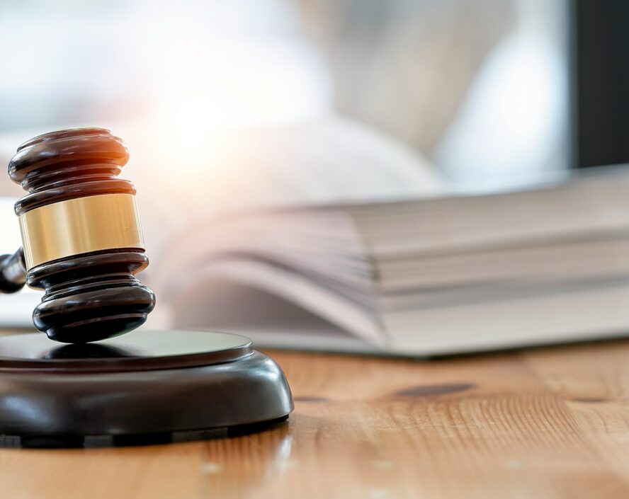 a wooden gavel and book on a table