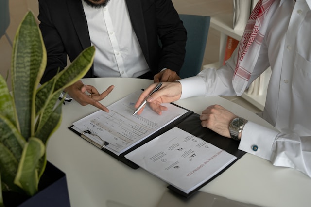 two people discussing about a document