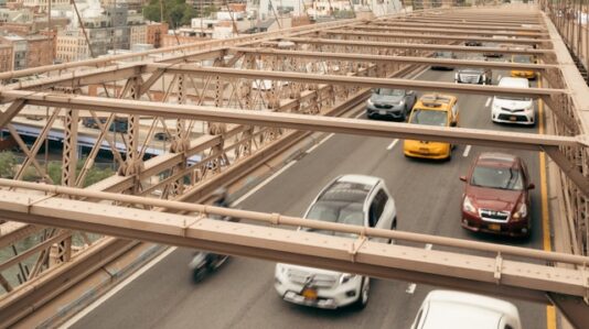 top shot of vehicles passing the bridge